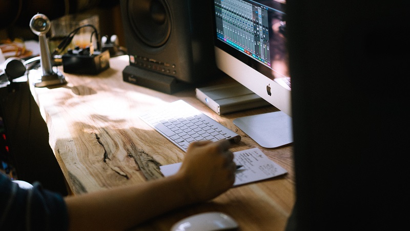 man in recording studio mac computer music